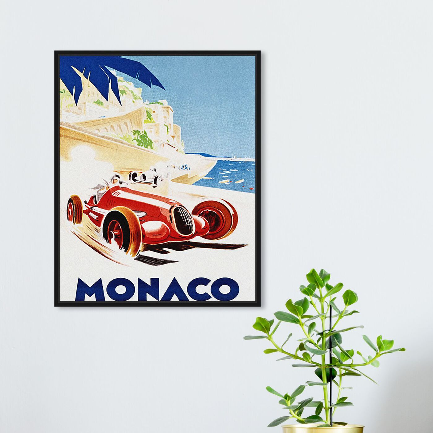 Hanging view of Monaco Grand Prix featuring advertising and posters art.
