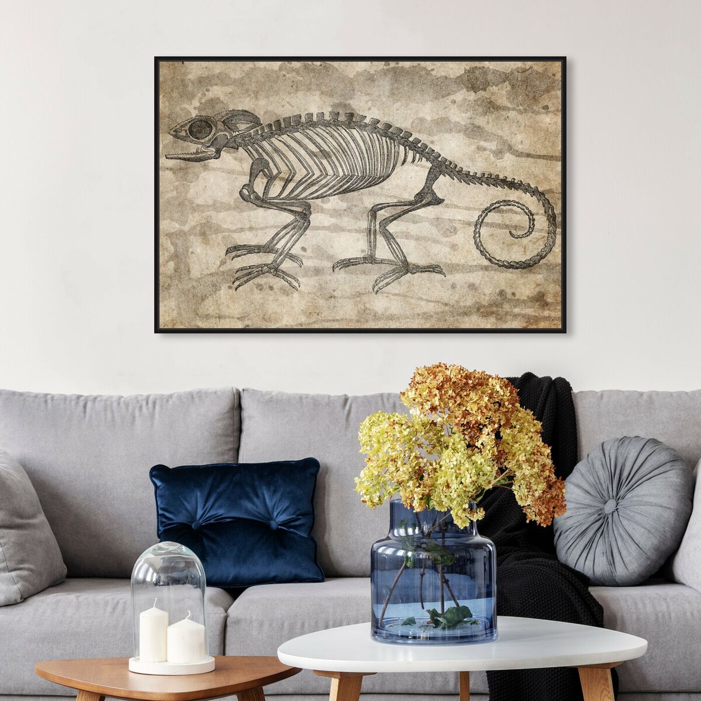 Hanging view of Karma Chameleon featuring animals and skeletons art.