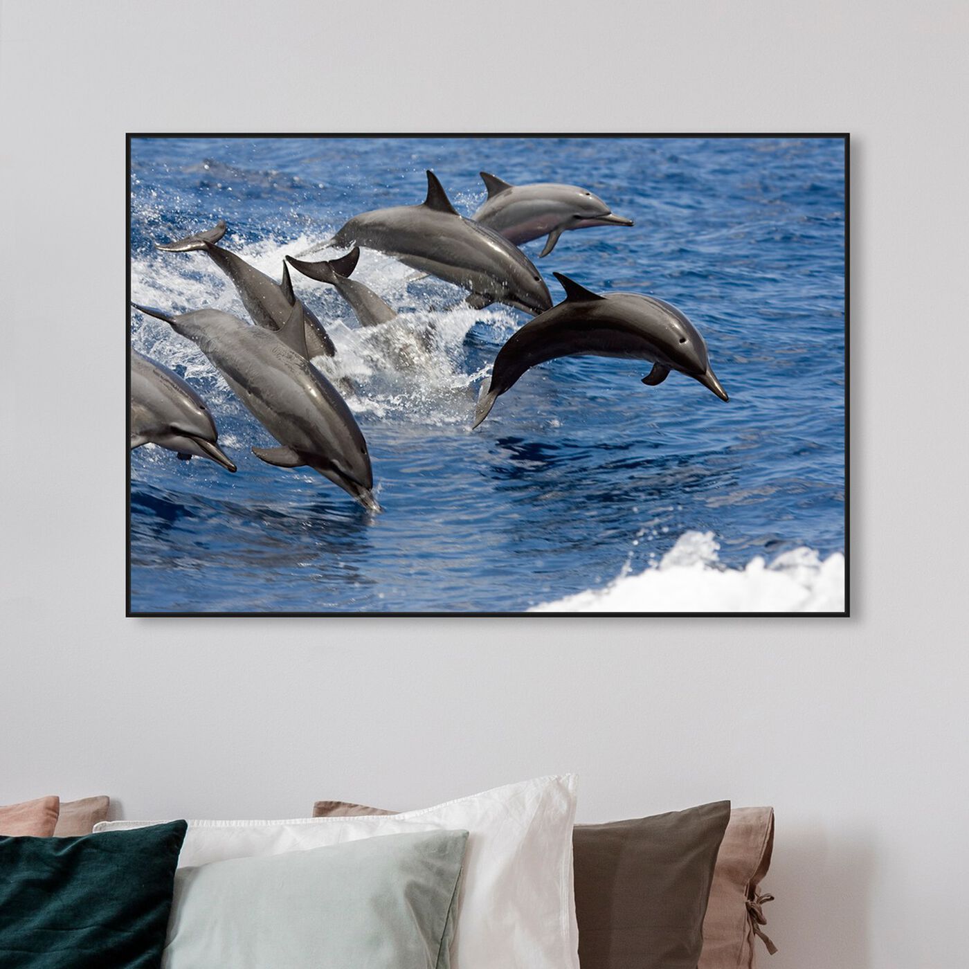 Hanging view of Spinner Dolphins by David Fleetham featuring nautical and coastal and marine life art.