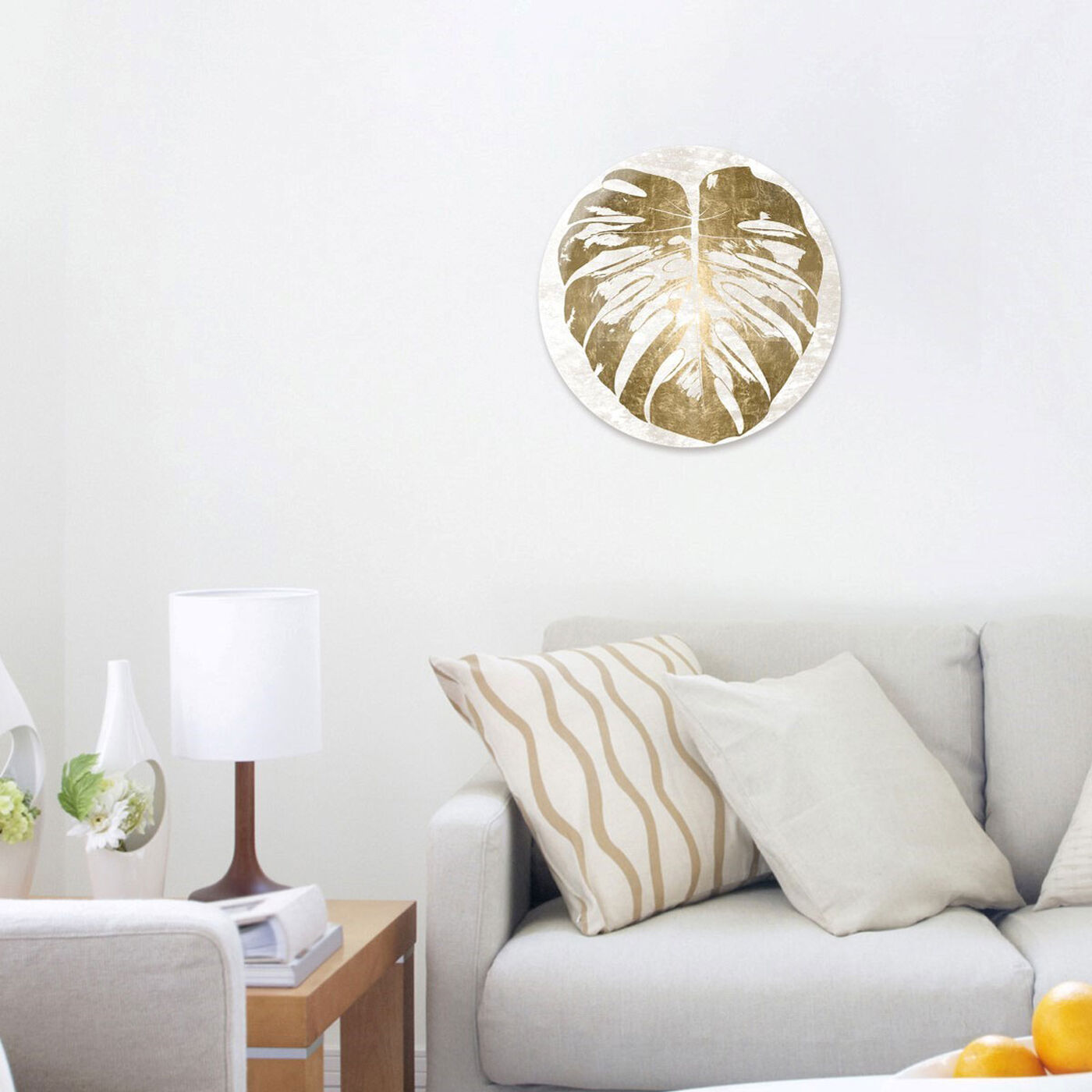 Hanging view of Monstera Leaf Gold Round featuring floral and botanical and botanicals art.